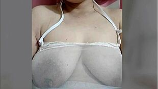 Is juliana touching her swollen nipples?