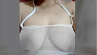 Is juliana touching her swollen nipples?