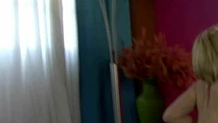 Oiled model poses in bikini