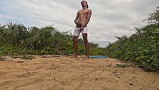 african guy jerks off and cums on the beach