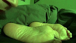 Steamy footage of tickling the feet of a beautiful woman who is asleep