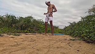 african guy jerks off and cums on the beach
