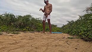 african guy jerks off and cums on the beach