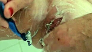 A big clit shaving experience with a sensual shower and pee play