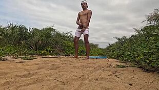 african guy jerks off and cums on the beach