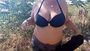 milf with wet big boobs sucks on a toy during outdoor public massage session