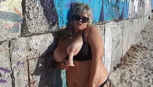 milf with wet big boobs sucks on a toy during outdoor public massage session
