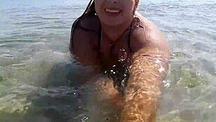 milf with wet big boobs sucks on a toy during outdoor public massage session