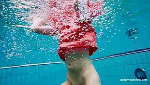 Avenna swims nude in the pool, her tight pussy exposed