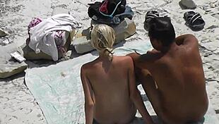 Slim blonde voyeur jerks with boyfriend at beach