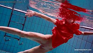 Avenna swims nude in the pool, her tight pussy exposed