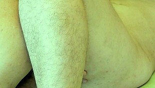 A mature woman gets a hairy cunnilingus orgasm