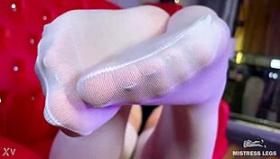 goddess with big booty teases feet in white stockings on red couch