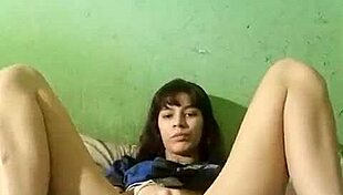 Celeste is having some fun on webcam, stroking herself.