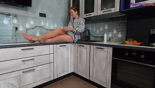 mature redhead iris shows legs and feet in tan pantyhose.