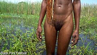 slim african woman bathing in river