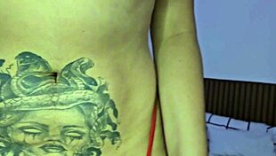 Pornstar performs solo striptease in bedroom.