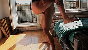 The balaklava guy holds the girl's neck in her new costume while destroying her pussy and throat