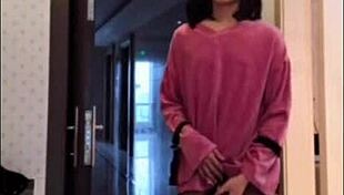 Asian ladyboy masturbates her dick, flashes it to woman, and cums.