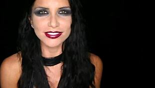 Chained and roughed up by Derrick Pierce, the brunette gets blowjob and cumshot on her big tits.