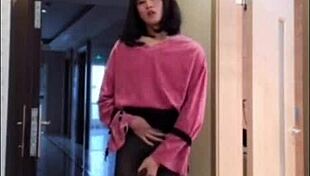 Asian ladyboy masturbates her dick, flashes it to woman, and cums.