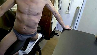 skinny bodybuilder grinds on stool in briefs