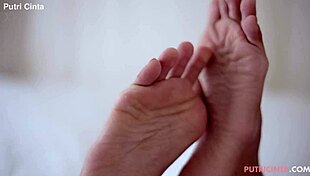 Putri Cinta In Unwind Scene With Asian Model