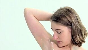 Sweet teen shaves herself carefully.