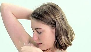 Sweet teen shaves herself carefully.