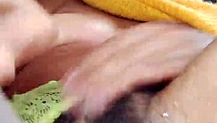 this hairy slut bounces on a dildo, squirting hard from her wet pussy while losing control.