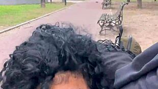 Feeling excited drinking milk outdoors in Buenos Aires park.