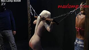 Sadistic guy canes petite blonde babe's narrow ass in BDSM