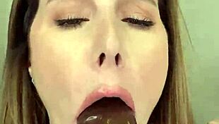 paige in fishnets takes a big black dildo and finishes with her mouth