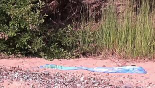 Hidden Cam Captures Couple Fucking MILF on Beach