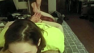 This redhead slut lays on her belly, deepthroating like a submissive slave