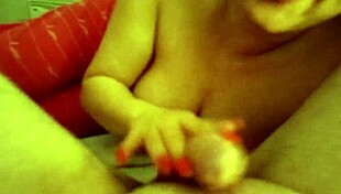 In this closeup scene, a couple engages in sucking dick and handjob for cum