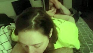 This redhead slut lays on her belly, deepthroating like a submissive slave