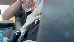 Artemisia Love flashes her big tits while driving, showcasing her long hair fetish.