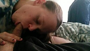 the wife, horny and eager, sucks her husband's cock in bed