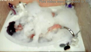 asian boy enjoys solo bubble bath in homemade bathroom setting