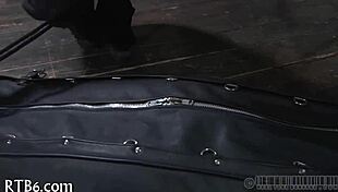 hey, this restrained girl is getting punished hard in the garage