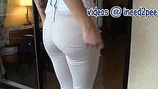 Sexy Persian girl peeing in her tight jeans, looking hot.