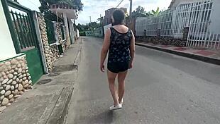 Latina Woman in Shorts Walking on the Street with Stepson