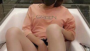 shemale ting xuan relaxes in the bathtub with her skirt on, masturbating barefoot while showing off her feet