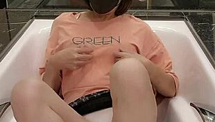 shemale ting xuan relaxes in the bathtub with her skirt on, masturbating barefoot while showing off her feet