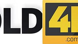 Old guitarist lets young fan play with his instrument.