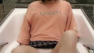 shemale ting xuan relaxes in the bathtub with her skirt on, masturbating barefoot while showing off her feet