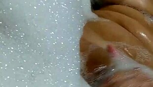 Are you watching this hot brunette masturbating and orgasming on a giant dildo in the bathtub