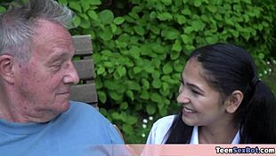 cute brunette nurse helps older patient with treatment