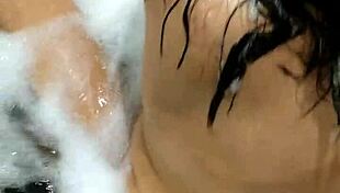 Are you watching this hot brunette masturbating and orgasming on a giant dildo in the bathtub
